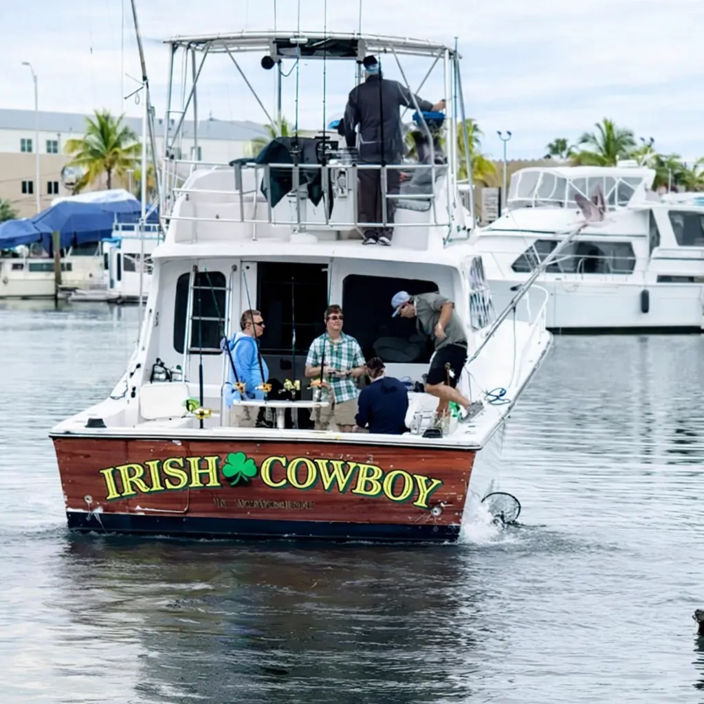 Irish Cowboy – 36' Hatteras Sportfisher stern view departing marina, Key West FL