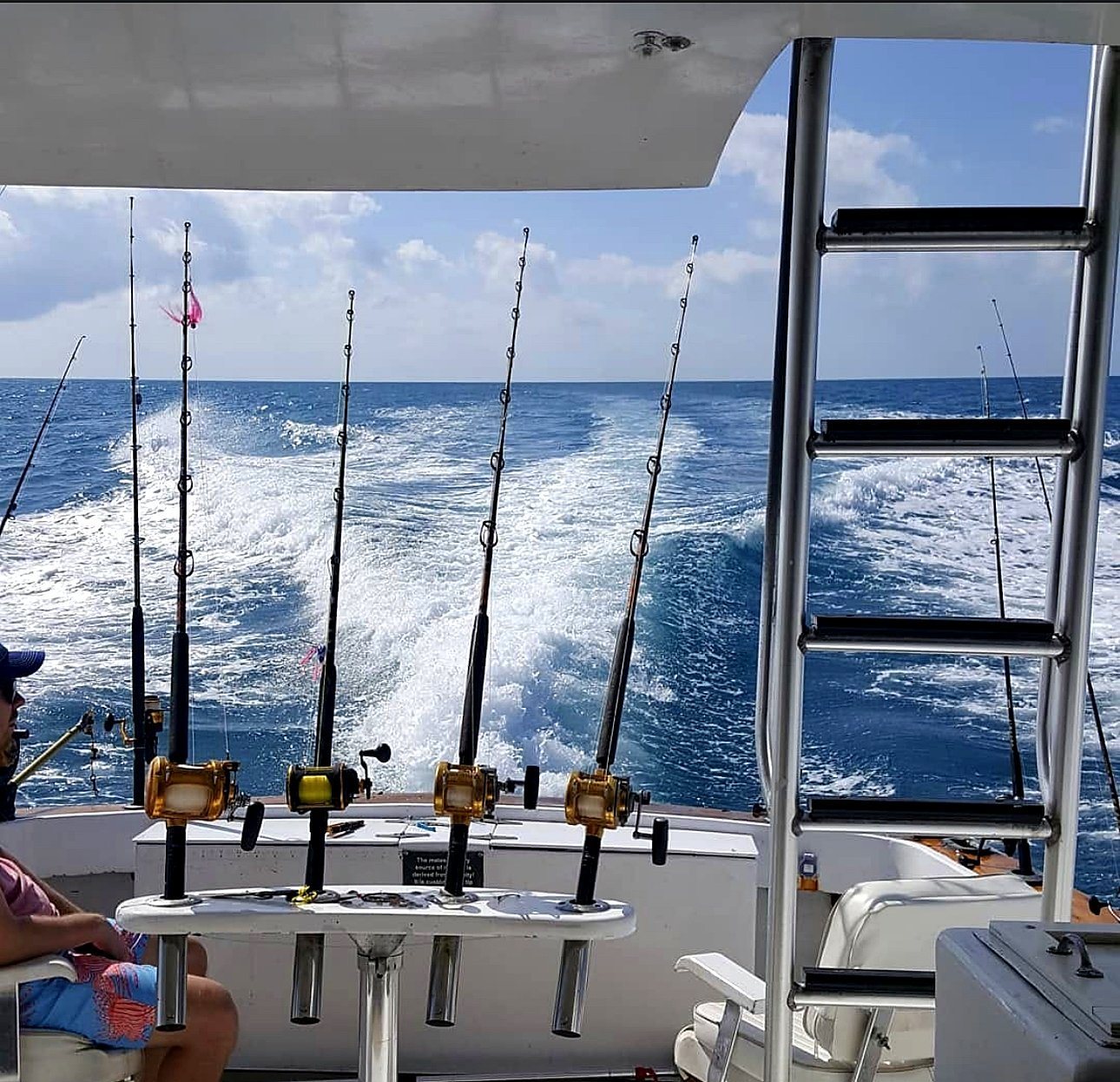 The Cowboy – view from inside the cabin looking out at the wake through the fighting chairs and rod holders, Key West FL