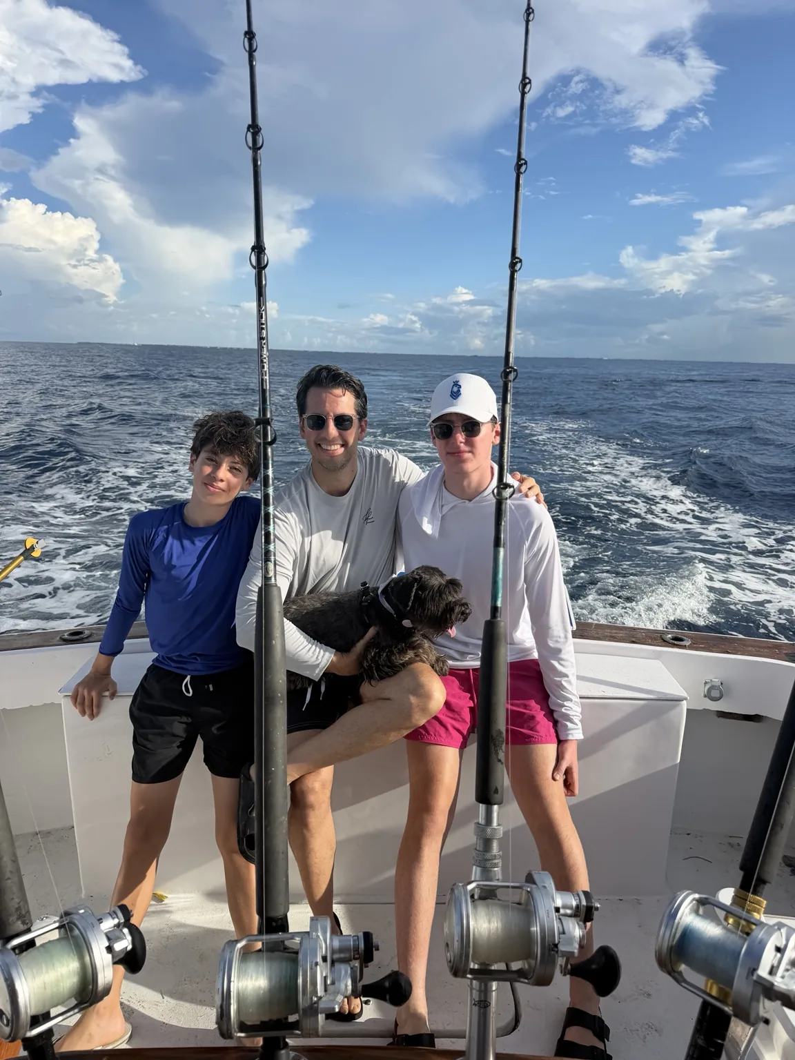 Family with their dog aboard a fishing charter in Key West
