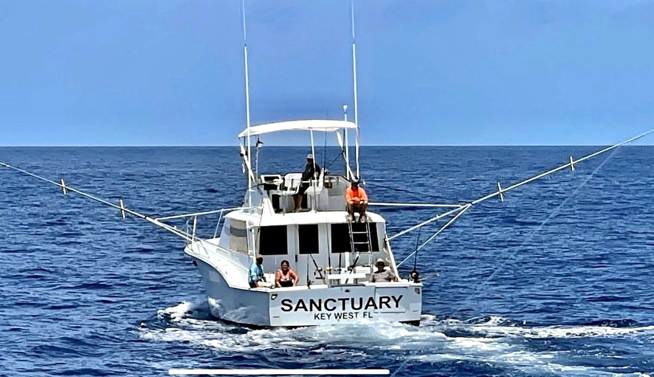 The Sanctuary – offshore under way in blue water off Key West FL with anglers in the cockpit
