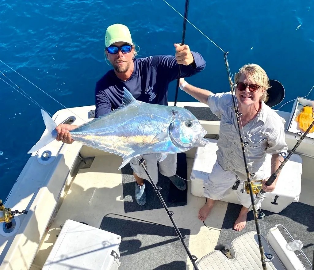 Long-Time Angler Lands African Pompano on Key West Offshore Charter Smiling fisherman holding an African pompano after a successful offshore fishing trip in Key West
