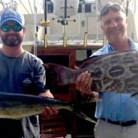 a man holding a fish