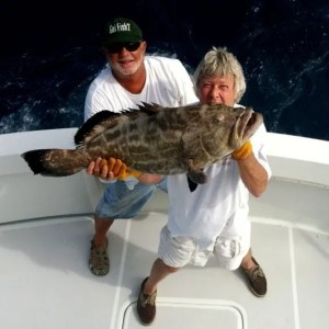 a man holding a fish