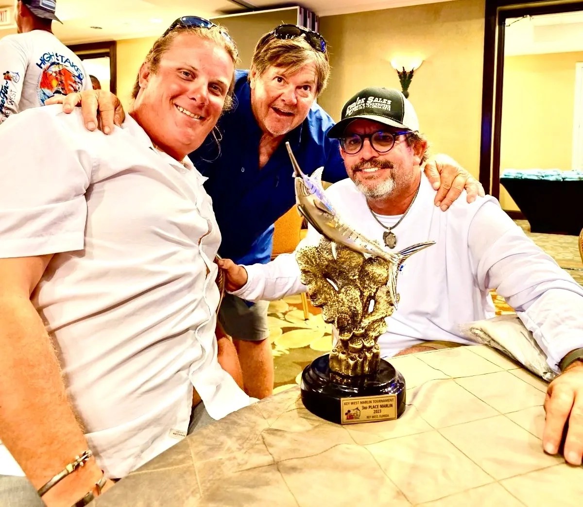 Marlin Tournament Champions – Key West Fishing Victory Cowboy Cowgirl Sportfishing crew and happy customer celebrating a marlin tournament win in Key West, Florida