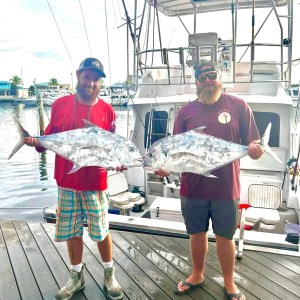 a group of people standing on a bridge