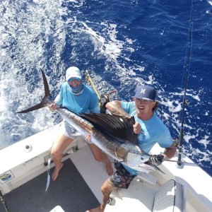 a man holding a fish