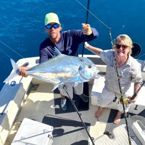 a person holding a fish