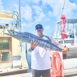 a man holding a fish