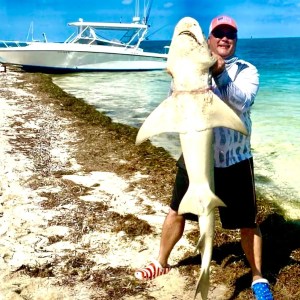 a person standing on a boat in the water