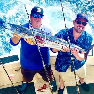 a man holding a pole in the snow