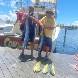a group of people standing on a boat