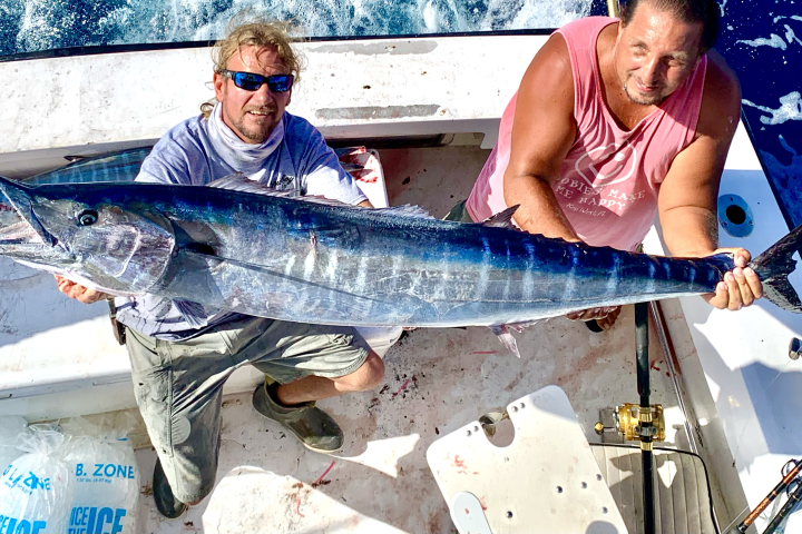 big wahoo with two men